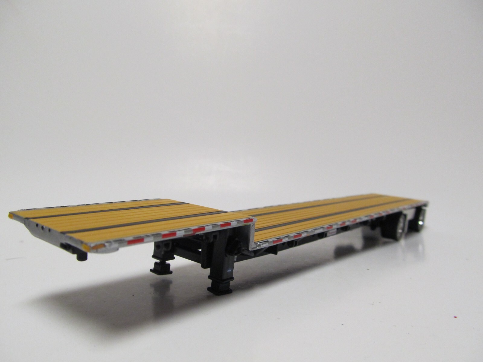 DCP 1/64 SCALE TRANSCRAFT STEP DECK TRAILER TAN / BROWN DECK WITH BLACK FRAME