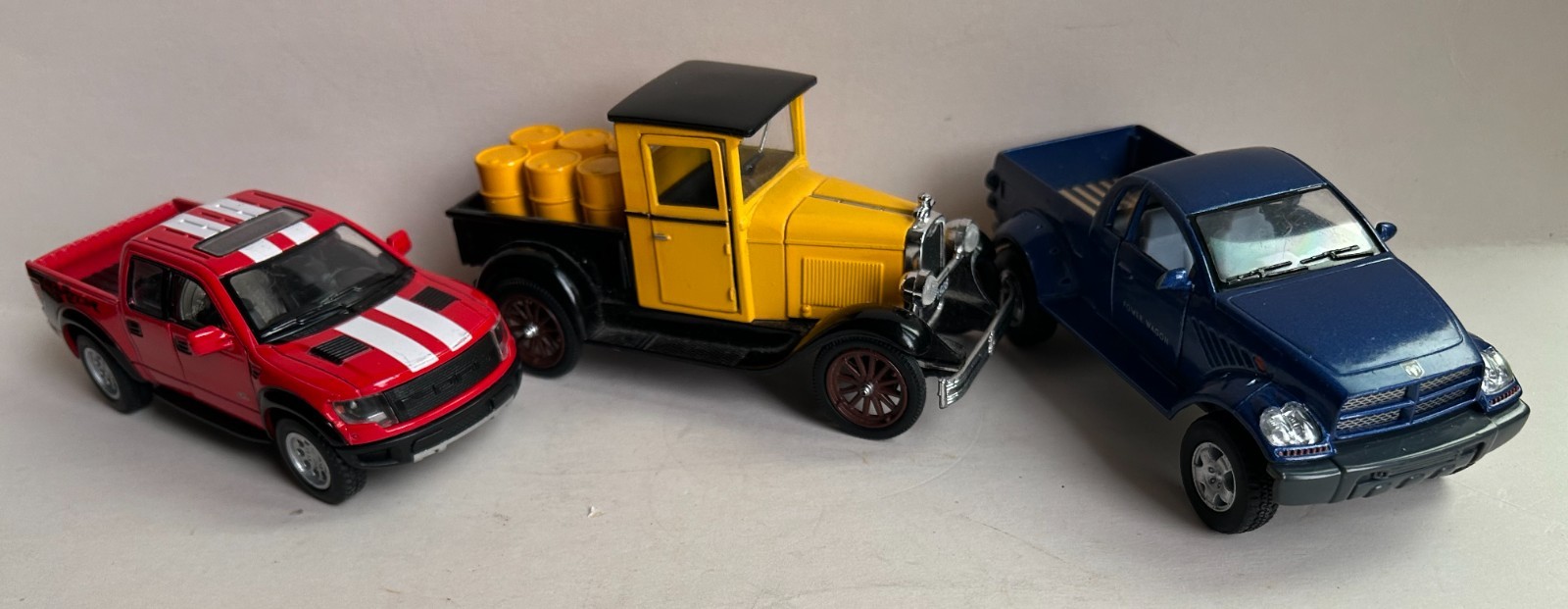 Lot of 3 Die-cast Trucks – 1/46 Scale – Dodge. Ford F 10 Raptor, 1928 Chevy – 5″