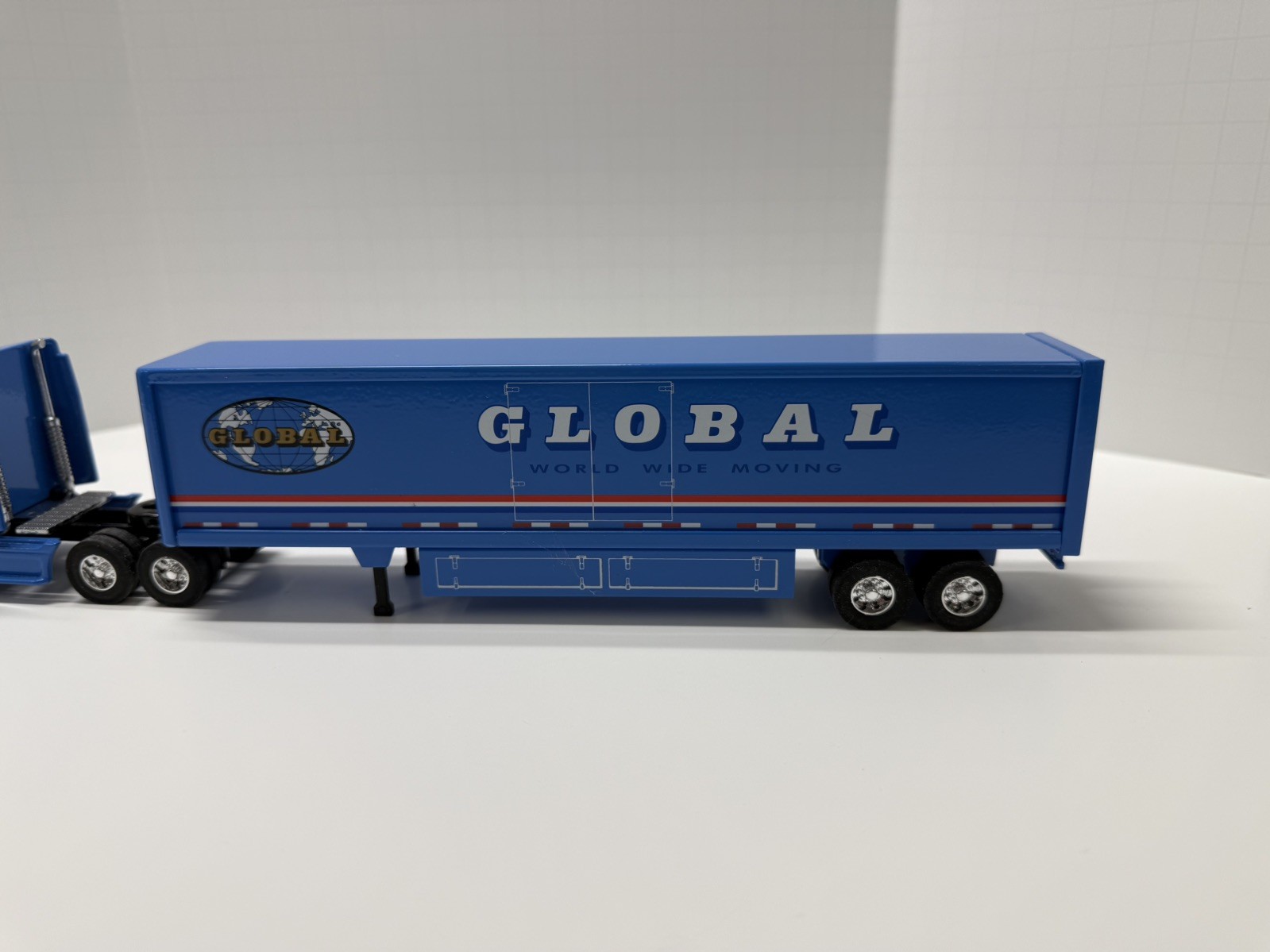 Global Van Lines 1:64 Diecast Tractor Trailer Semi Blue/White/Red. No box.