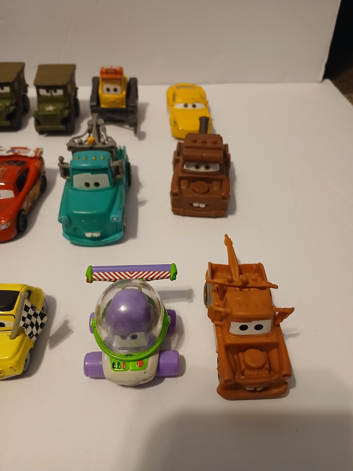 Disney Pixar Cars Lot Bundle of 26 Cars Die Cast And Plastic Lightning Mcqueen