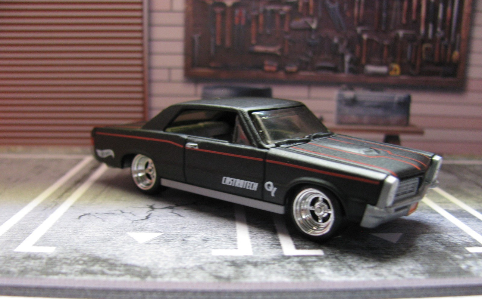 2026 Hot Wheels Matte Black/Red Stripes ’65 PONTIAC GTO w/Real Riders Wheel Swap
