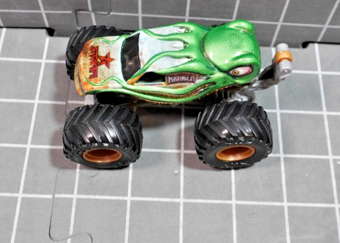 Lot of 4 Hot Wheels including Monster Jam Gears and Galaxies Pirates Curse 1/64