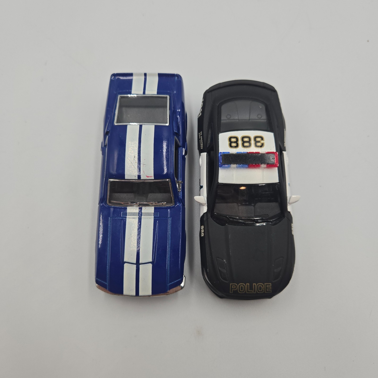 Lot of 3 – Kintoy model cars & Maisto Trailer