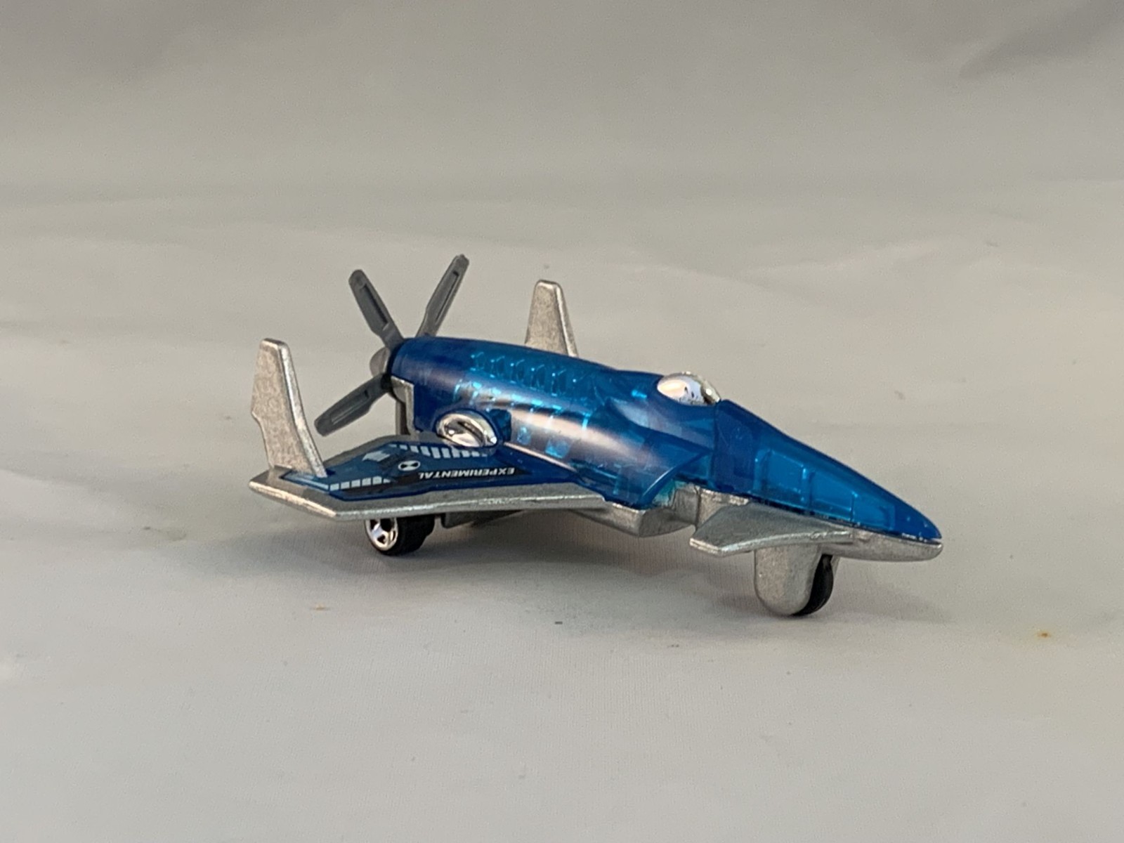 Hot Wheels Poison Arrow 2005 Kmart Clear Blue Micros