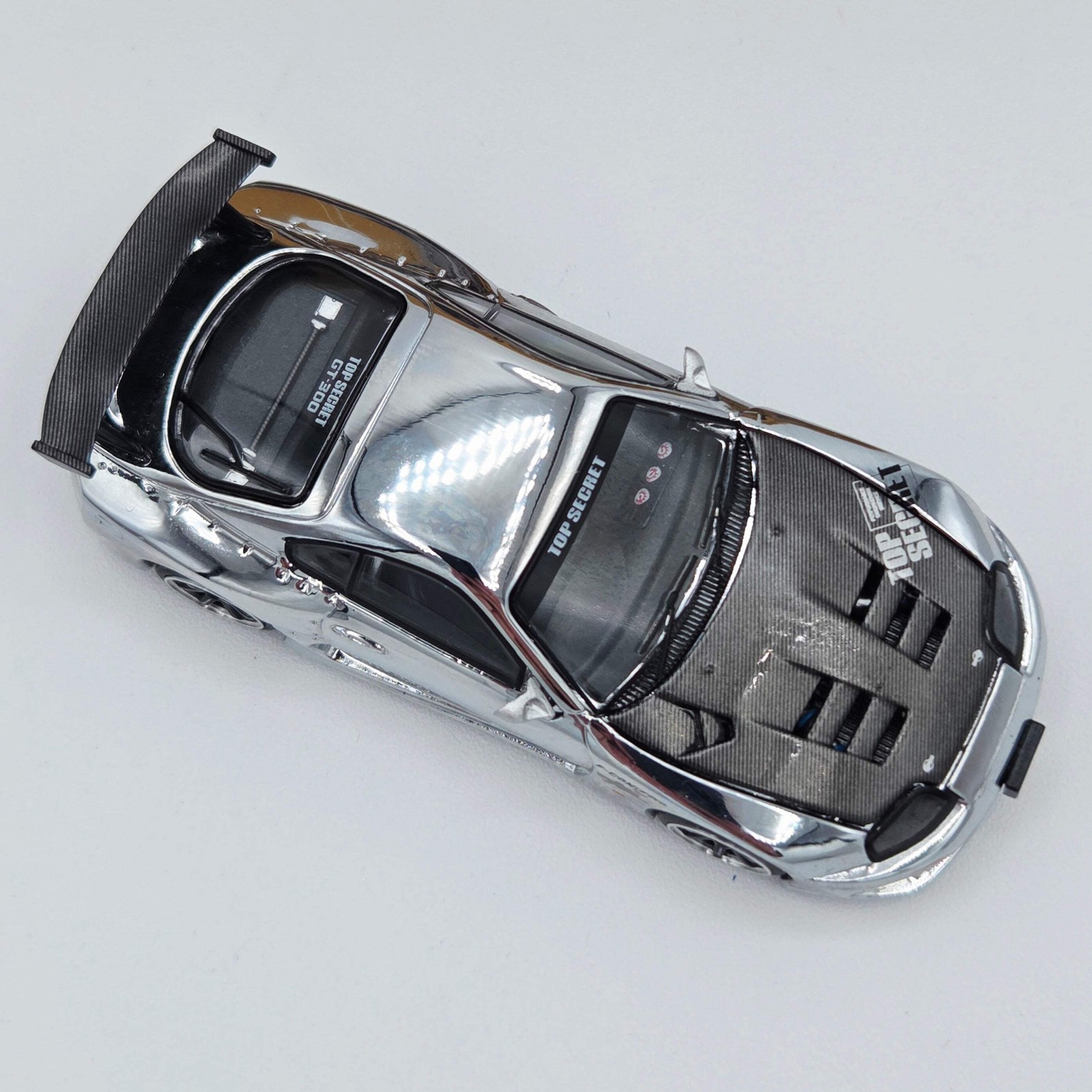 Pop Race Top Secret Toyota GT300 Supra – 1:64, Silver Chrome (2026)