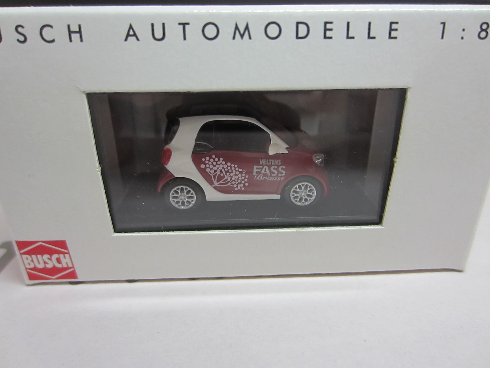 BUSCH 50713 SMART FORTWO COUPE 2015 VELTINS – model is PLASTIC – HO / 1:87 scale