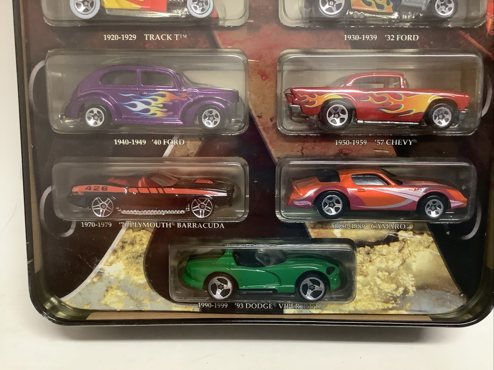 Hot Wheels Decades 1900-2000 Ten Vehicles Cars In Tin with Stand Box