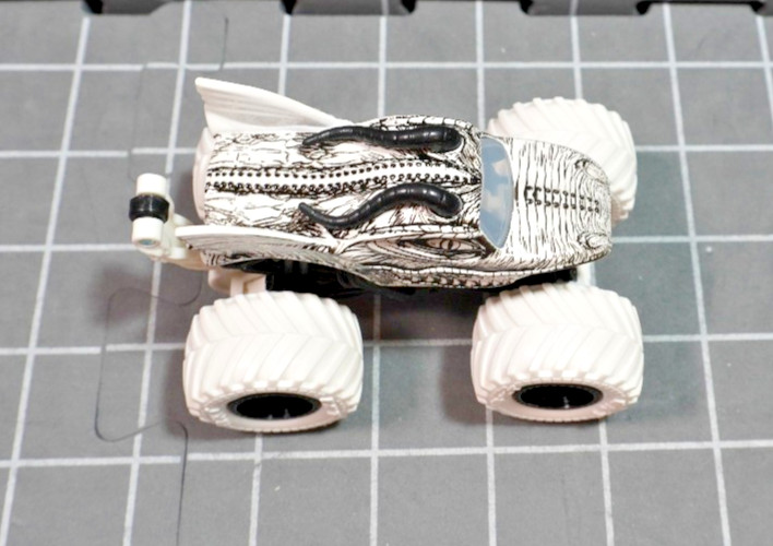 Lot of 4 Hot Wheels including Monster Jam Gears and Galaxies Pirates Curse 1/64