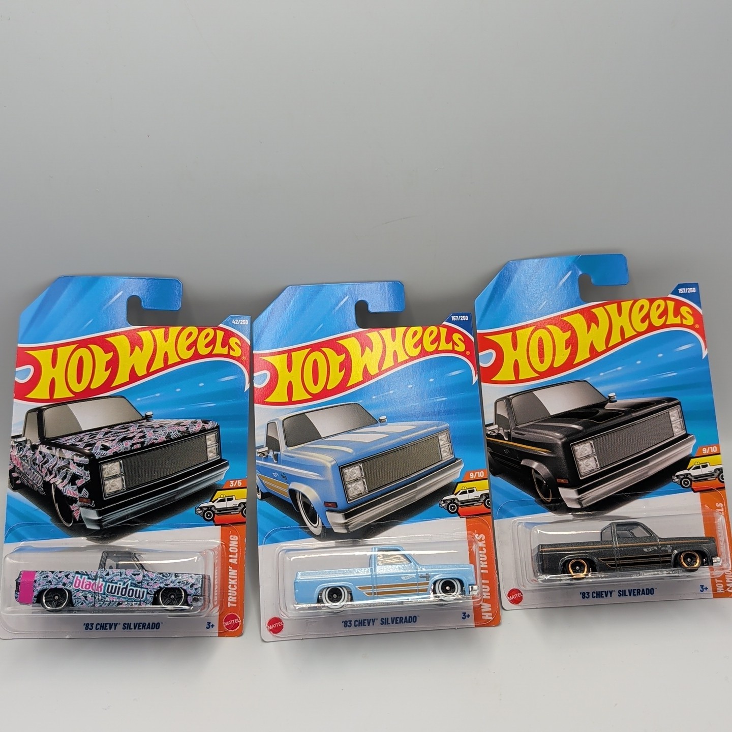 2026 HOT WHEELS ’83 CHEVY SILVERADO HW HOT TRUCKS GRAY BLACK WIDOW BLUE LOT OF 3