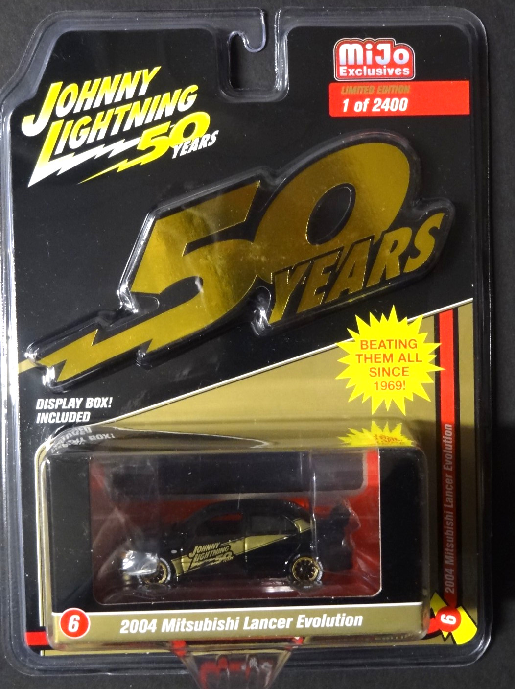 JOHNNY LIGHTNING – MIJO EXCLUSIVE – BLACK / GOLD – 2004 MITSUBISHI LANCER EVO