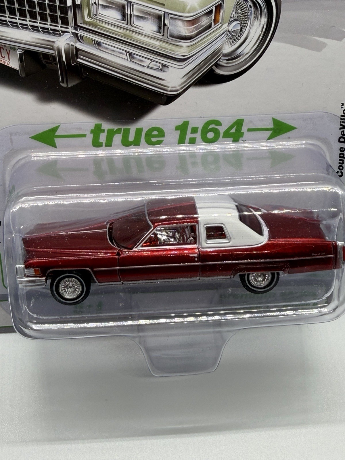 Auto World 1976 Cadillac Coupe DeVille ULTRA RED CHASE 1:64