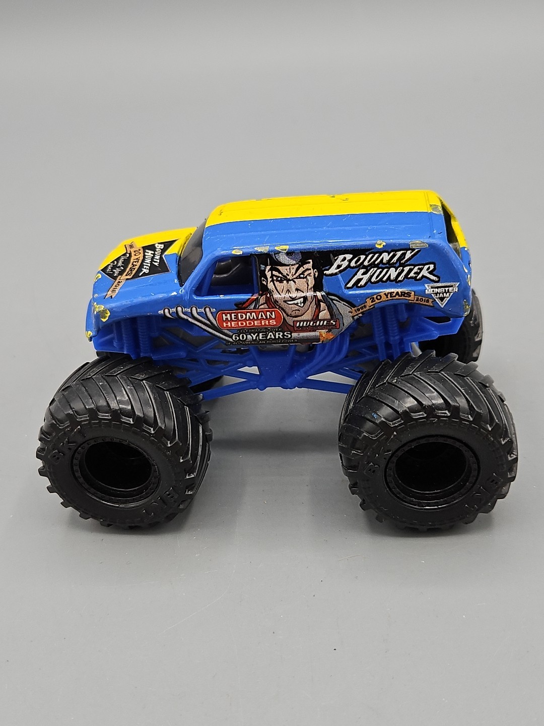 bounty hunter monster jam 1:64 diecast 20 years blue and yellow
