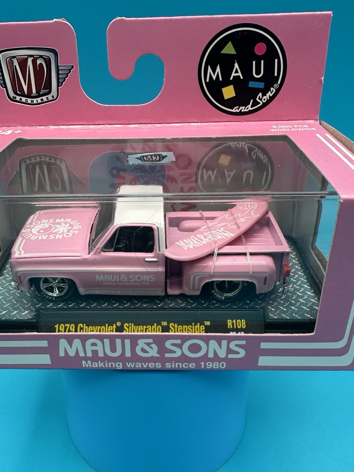 M2 Machines 1979 Chevrolet Silverado Stepside Maui & Sons Pink W/Surfboard K1