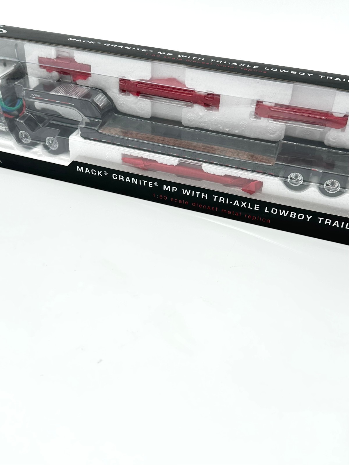 White & Black Mack Granite MP Truck w/Tri Axle Lowboy By First Gear 1/50th Scale