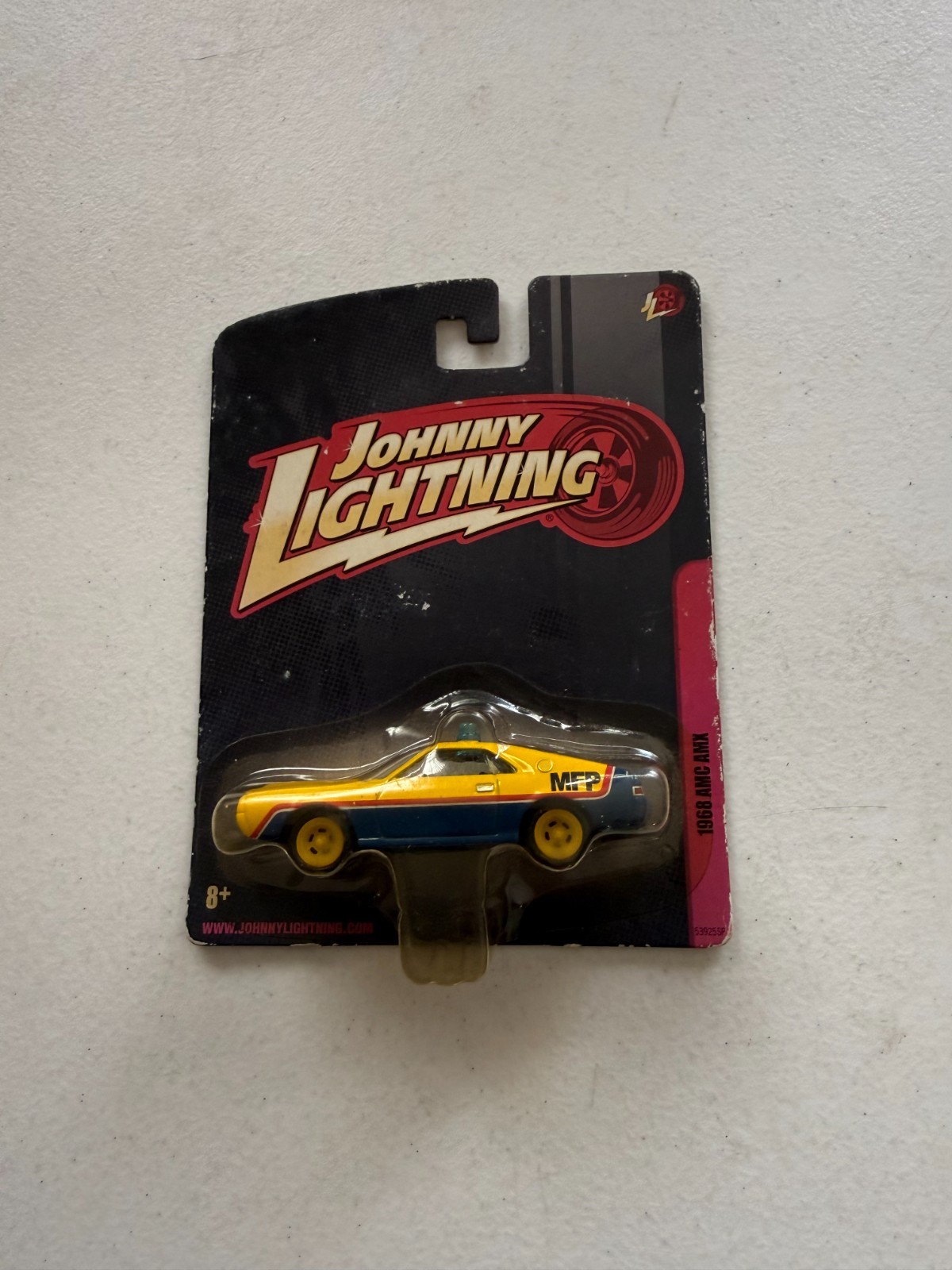 JOHNNY LIGHTNING 1968 AMC AMX IN BLUE AND YELLOW ‘MFP’ FROM MAD MAX P48