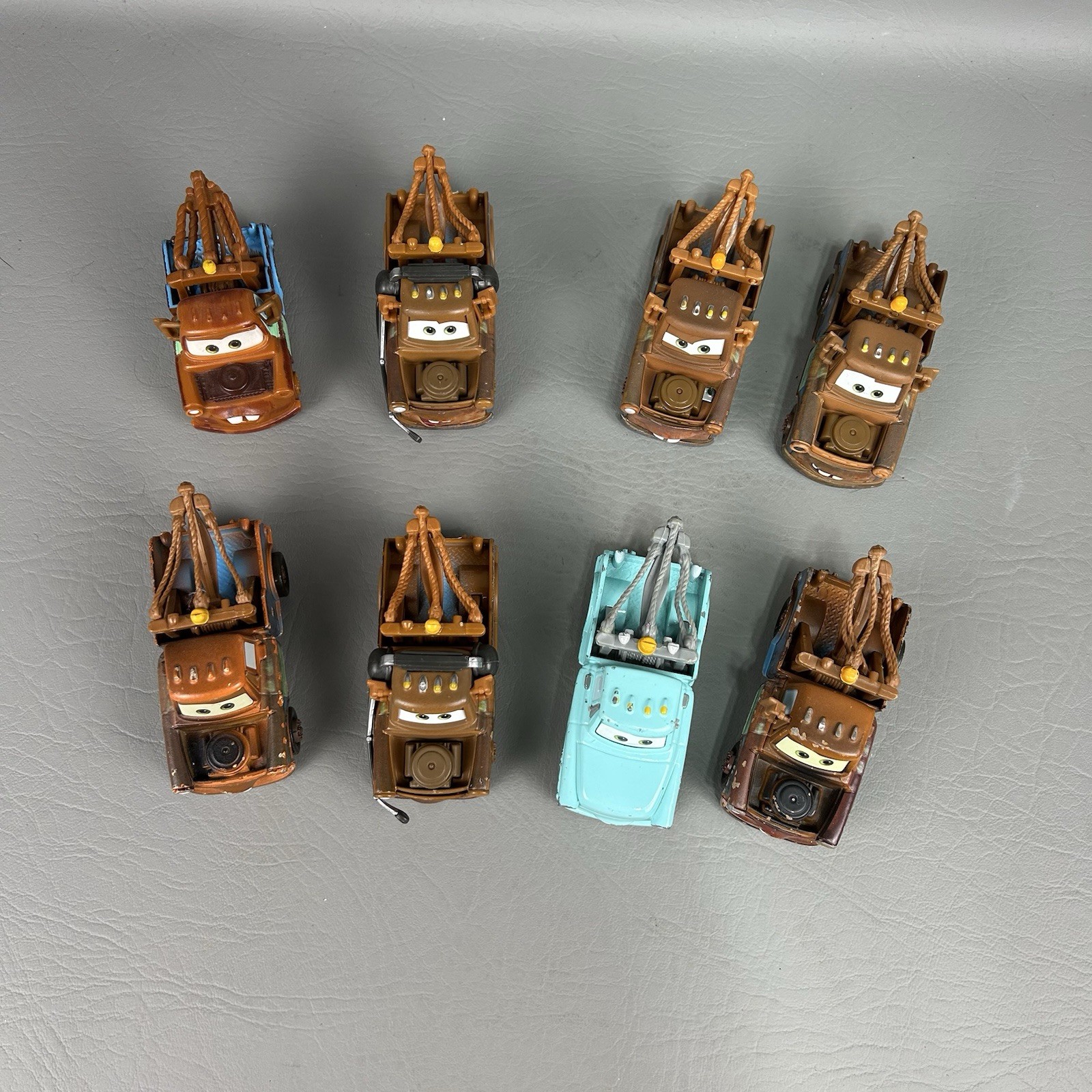 Disney Pixar Cars Diecast Tow Mater Lot of 8 One light blue Different Eyes