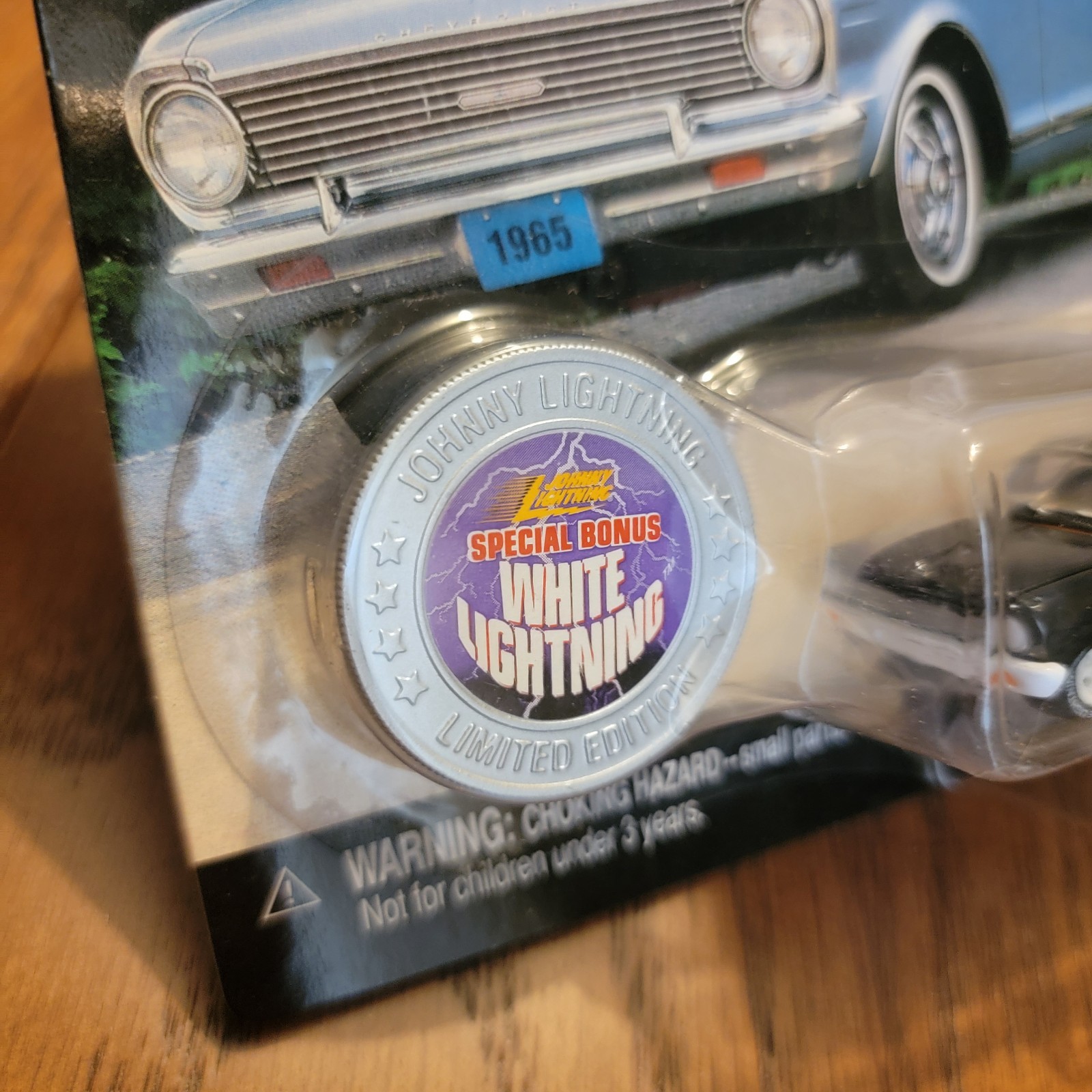 Johnny Lightning 1965 Chevy II Nova Black – 1:64 Diecast White Lighting
