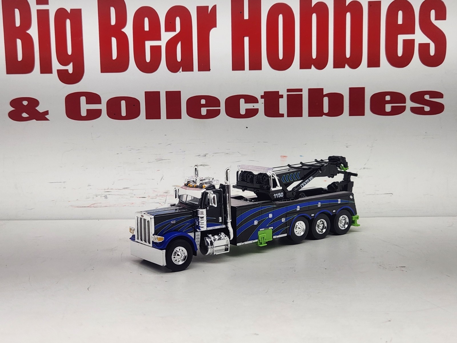 1/64 DCP/FG #60-2248 Black, Blue, & Green 389 DC Peterbilt Century 1150 Rotator