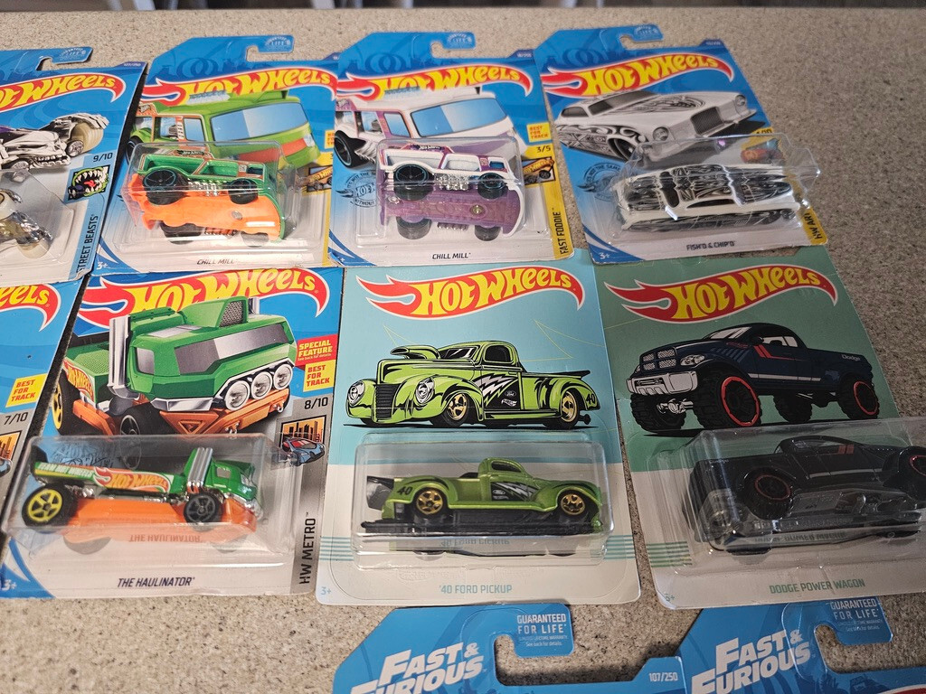 Lot OF 14 HOT WHEELS ALL NEW. VARIETY AND DIFFERENT YEARS. SEE PICS