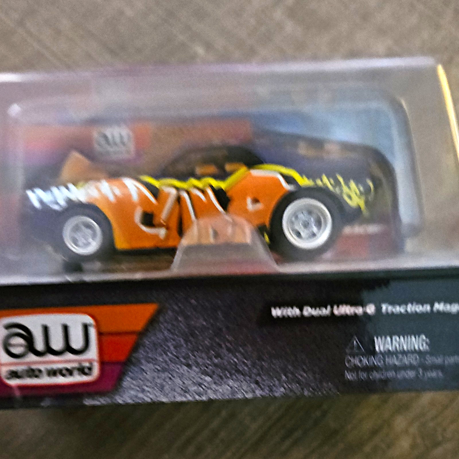 Auto World Carffiti 1:64 1970 Plymouth Cuda Orange/purple /Yellow Diecast Car