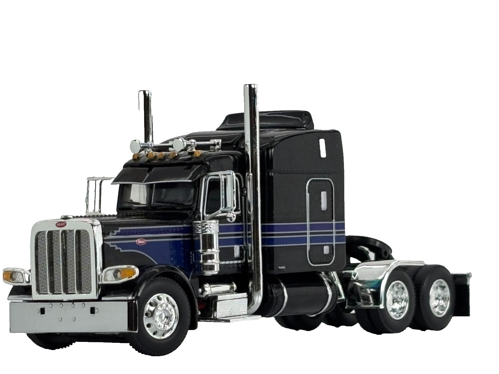 1/64 DCP BLACK/BLUE/SILVER PETERBILT 389 W/ 63″ MID ROOF SLEEPER W/ WHALE TAIL