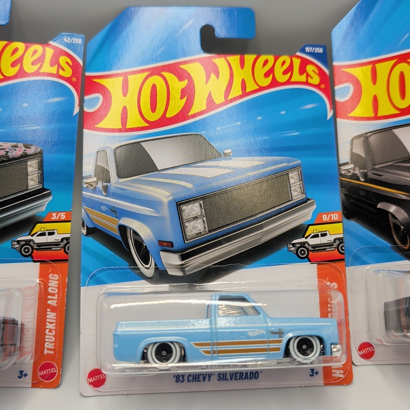 2026 HOT WHEELS ’83 CHEVY SILVERADO HW HOT TRUCKS GRAY BLACK WIDOW BLUE LOT OF 3