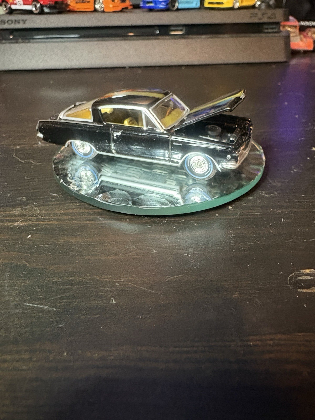 Auto World 1/64 Die-cast Model 1965 Plymouth Barracuda Formula S In Black