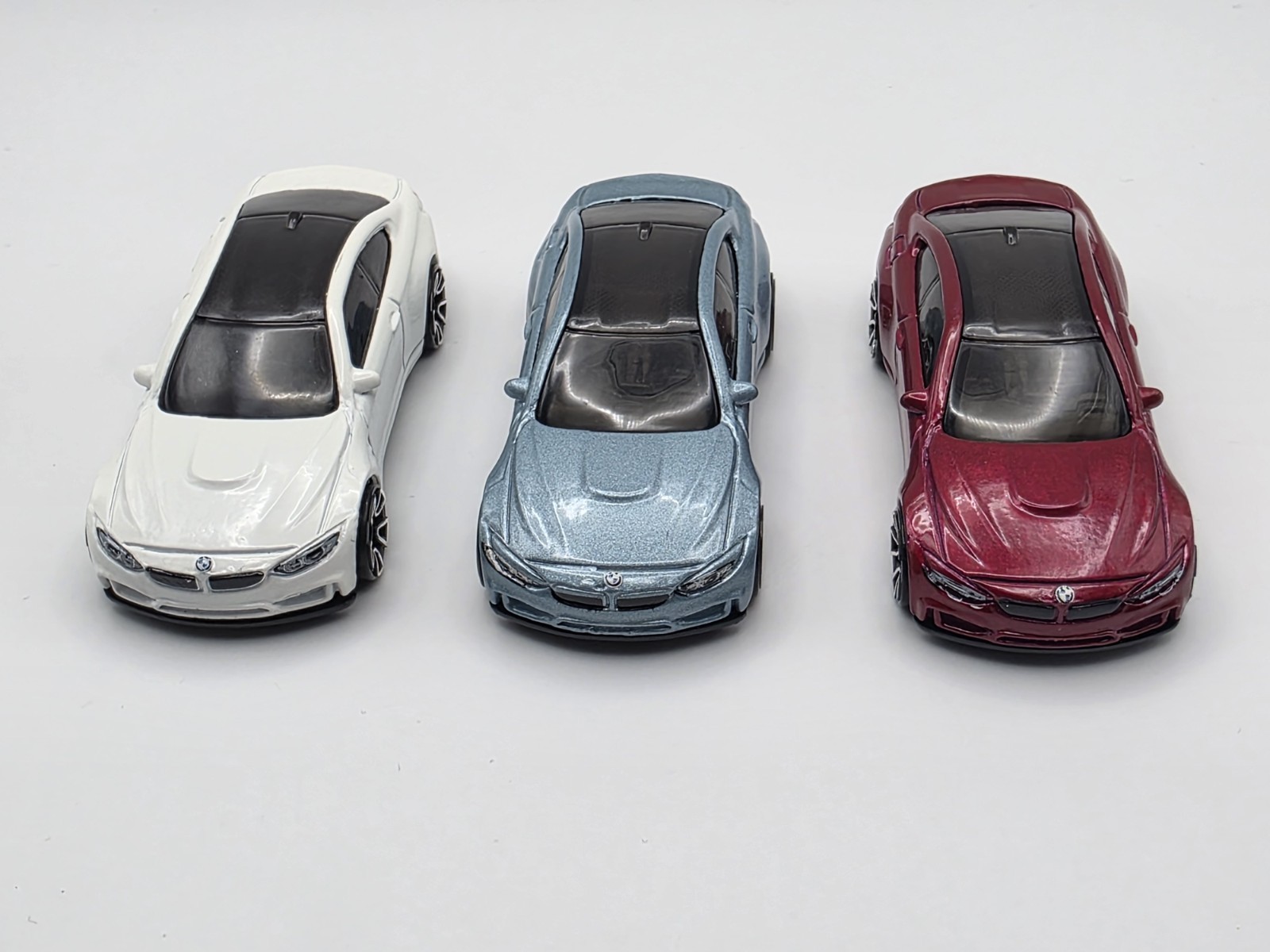 LOT OF (3) LOOSE HOT WHEEL BMW M4 IN LIGHT BLUE METALIC, WHITE AND BURGUNDY