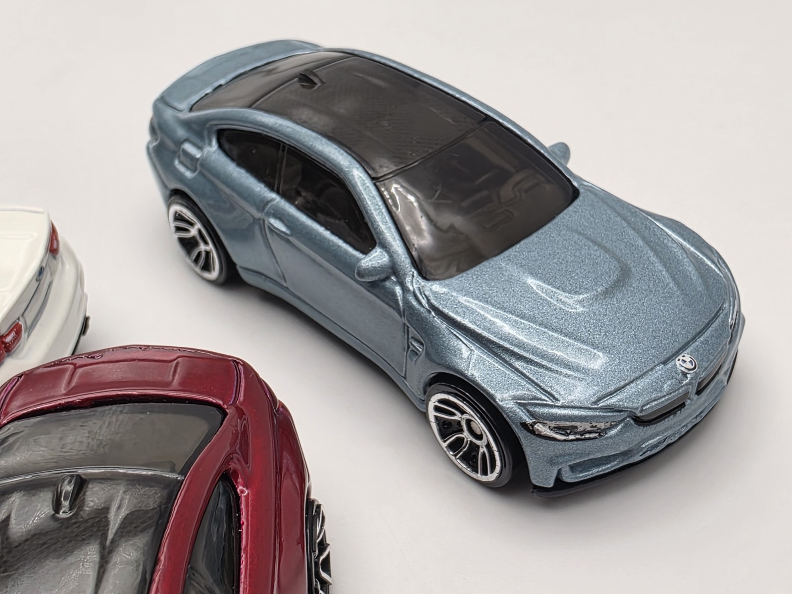 LOT OF (3) LOOSE HOT WHEEL BMW M4 IN LIGHT BLUE METALIC, WHITE AND BURGUNDY