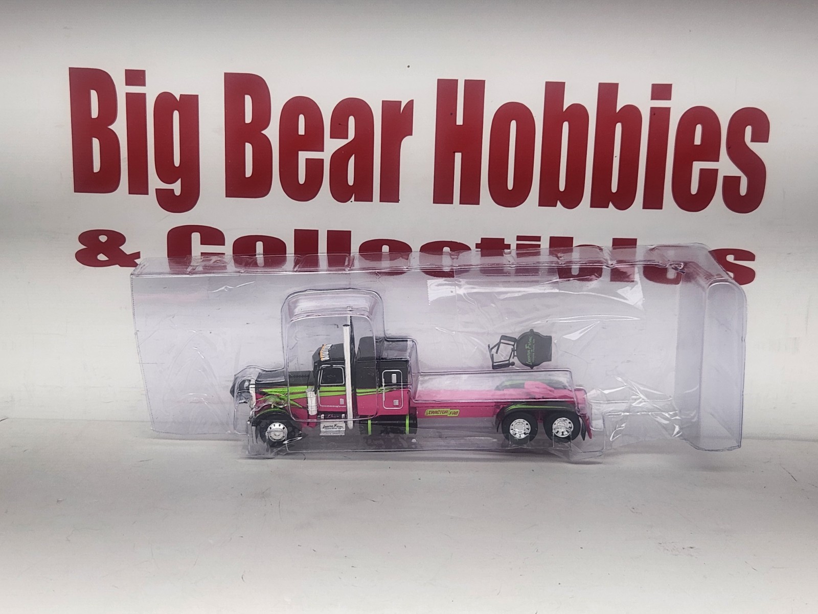 1/64 DCP Loewen Farms Pink, Black 389 Peterbilt With 60″ Flattop Sleeper