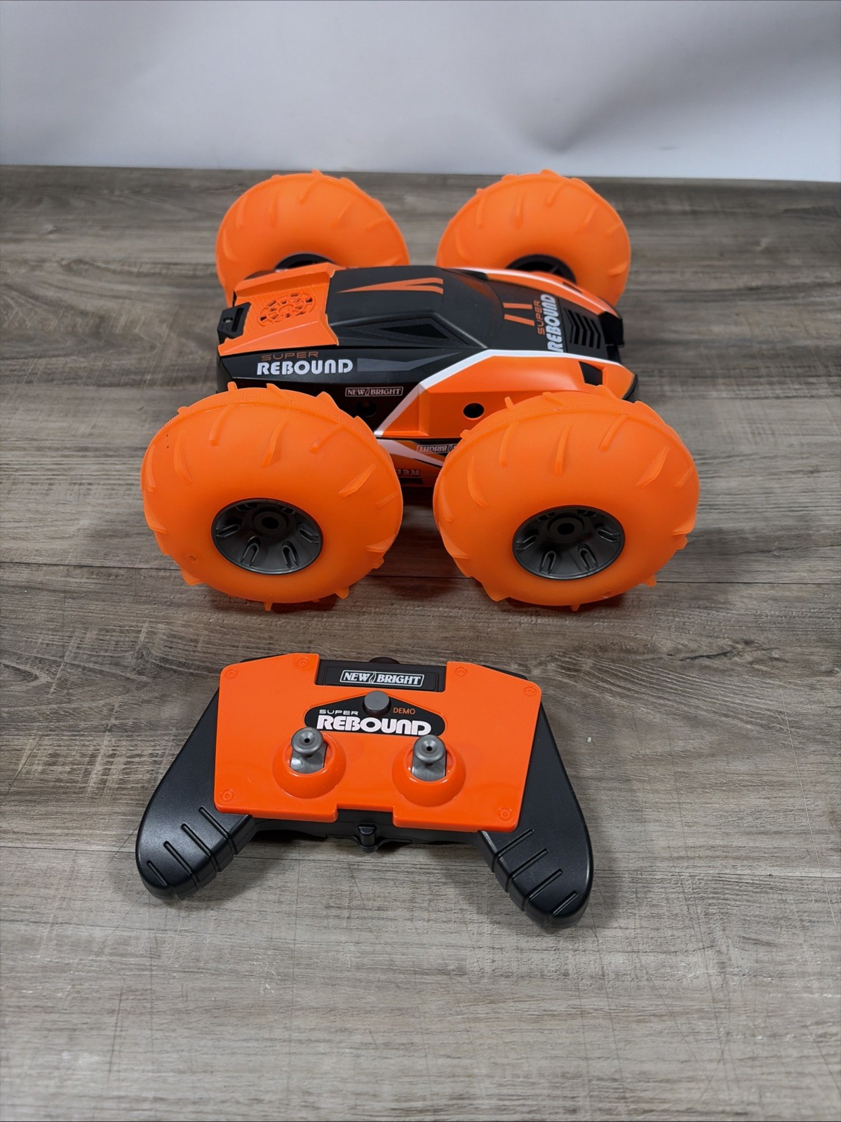 New Bright (1:16) Super Rebound Remote Control Orange Stunt Vehicle READ DESCR..