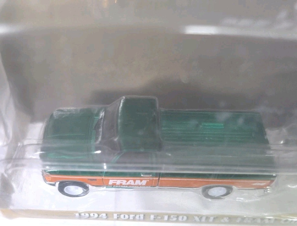 Greenlight Chase 1994 Ford F-150 XLT & Fram Oil Filters Enclosed Car Trailer