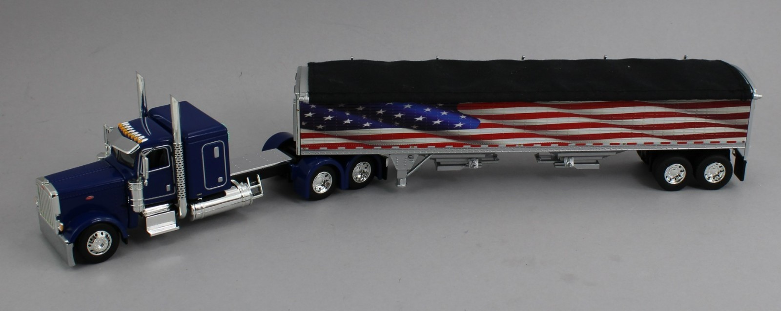 DCP 1:64 *BLUE AMERICA 250* Peterbilt 389 48″ Flattop w/Wilson Grain Trailer NIB