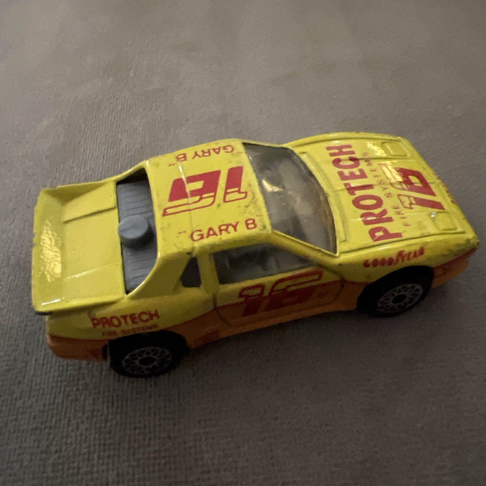 1985 Matchbox SuperFast SF19 Pontiac Fiero #16 ProTech Fire Systems Yellow LOOSE
