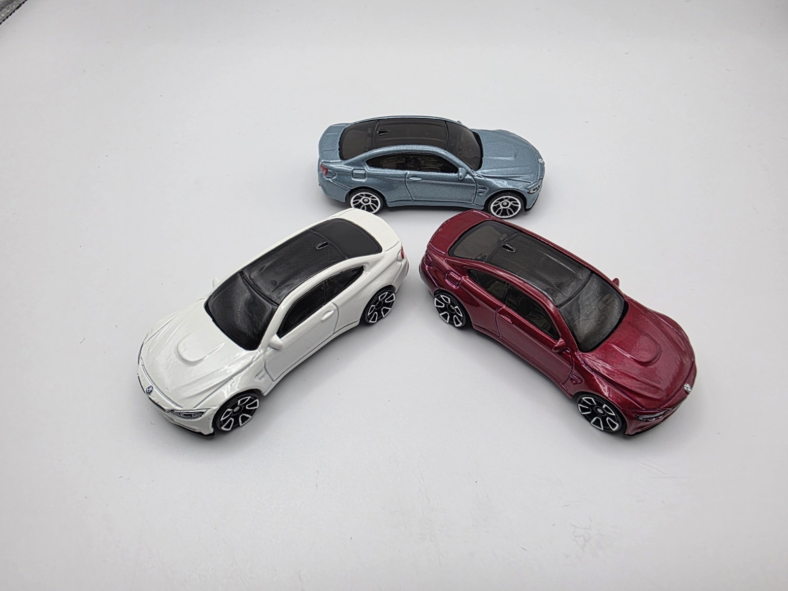 LOT OF (3) LOOSE HOT WHEEL BMW M4 IN LIGHT BLUE METALIC, WHITE AND BURGUNDY