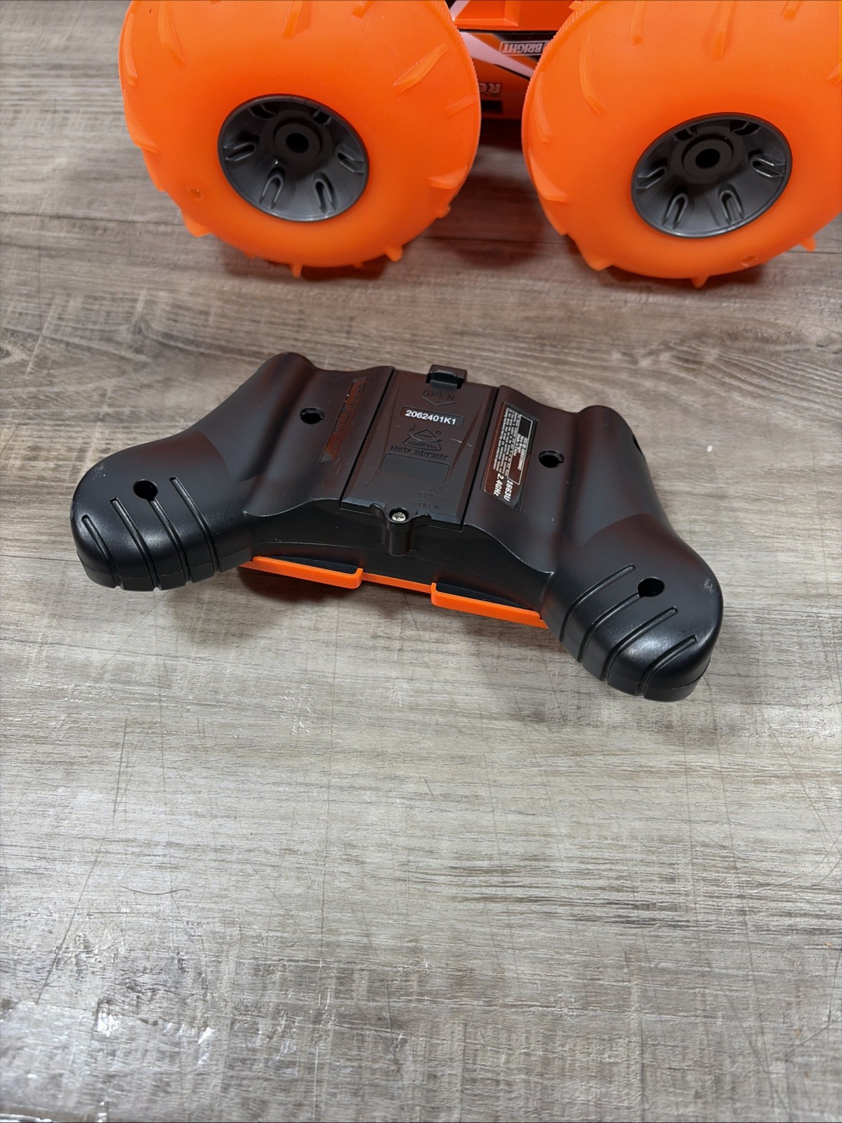 New Bright (1:16) Super Rebound Remote Control Orange Stunt Vehicle READ DESCR..