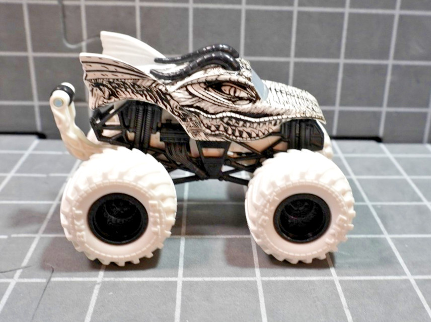 Lot of 4 Hot Wheels including Monster Jam Gears and Galaxies Pirates Curse 1/64