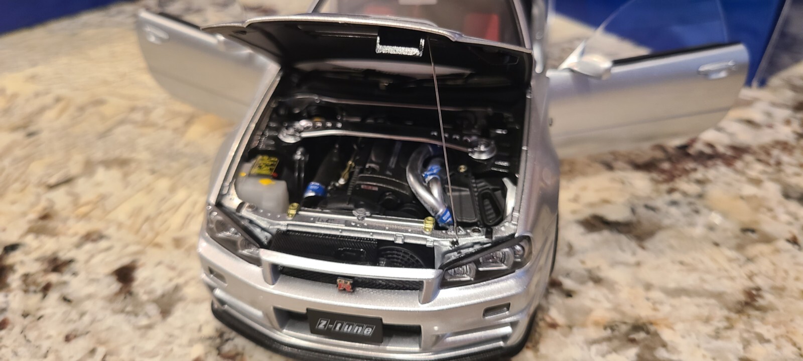 Nissan Skyline GT-R (R34) Z-Tune, Z-Tune Silver in 1:18 scale by AUTOart 77461