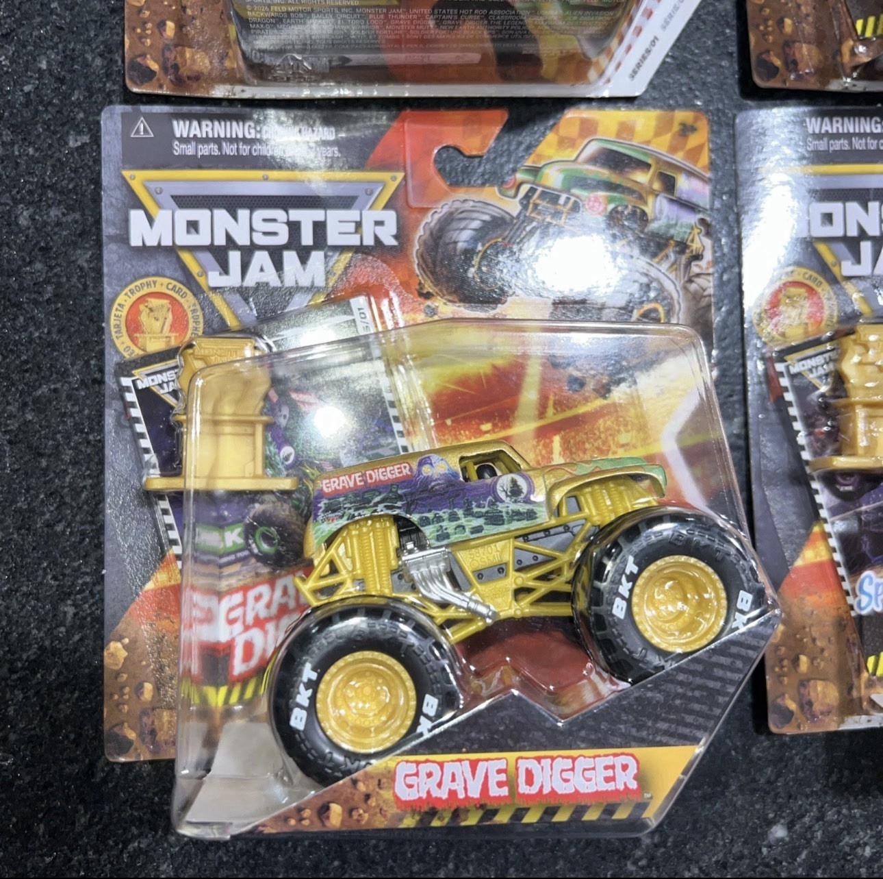 BRAND NEW! 2026 MONSTER JAM GOLD TROPHY TRGX SERIES #01 SET OF 4