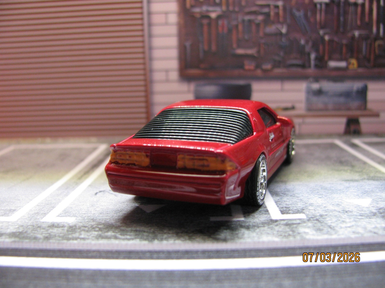 2025 Maisto Red 1985 Chevy Camaro IROC-Z, w/Real Riders Wheel Swap