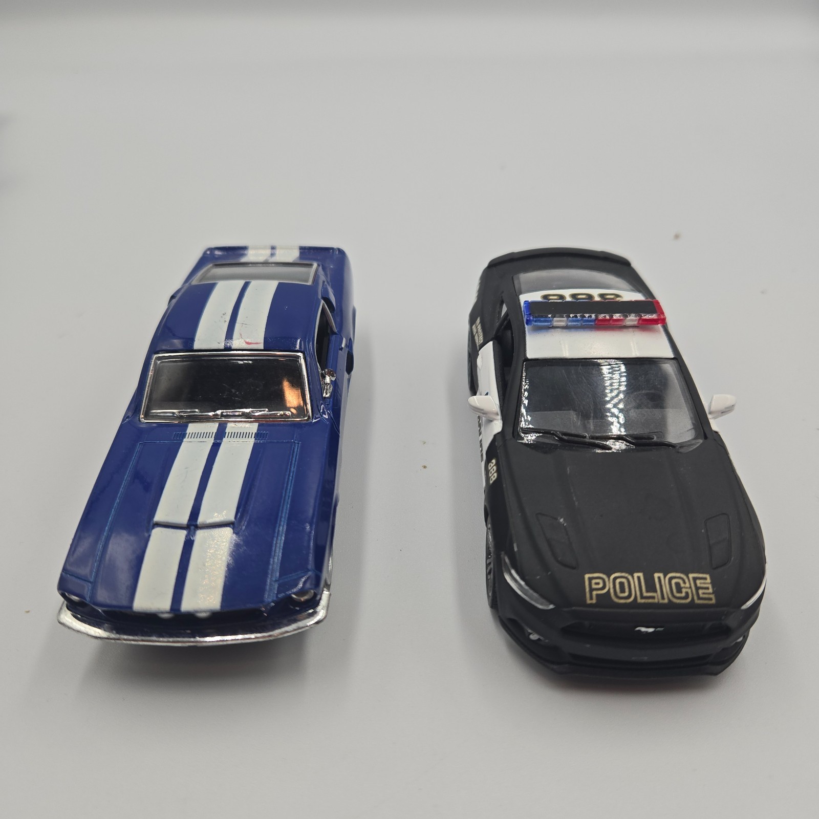 Lot of 3 – Kintoy model cars & Maisto Trailer
