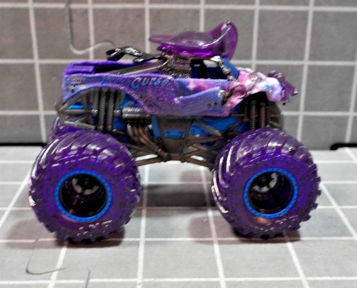 Lot of 4 Hot Wheels including Monster Jam Gears and Galaxies Pirates Curse 1/64