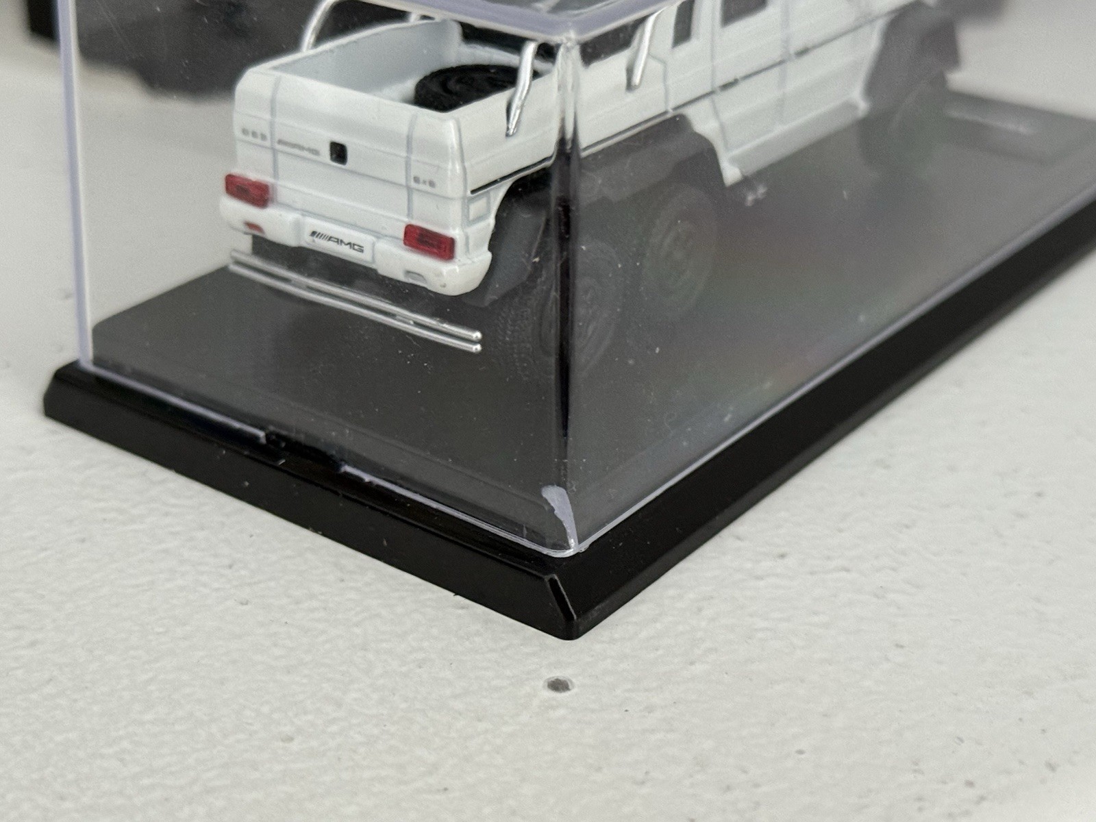 China 1:64 unbranded diecast Mercedes Benz G63 AMG 6×6 in white; premium model