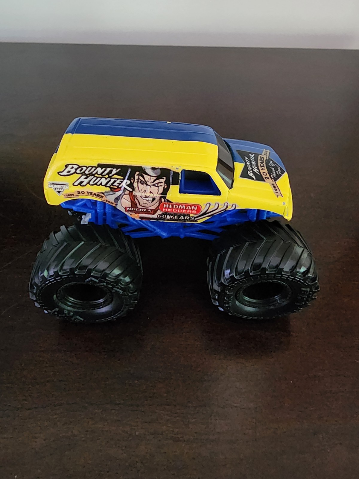 Bounty Hunter monster jam 1:64 diecast 20 years blue and yellow