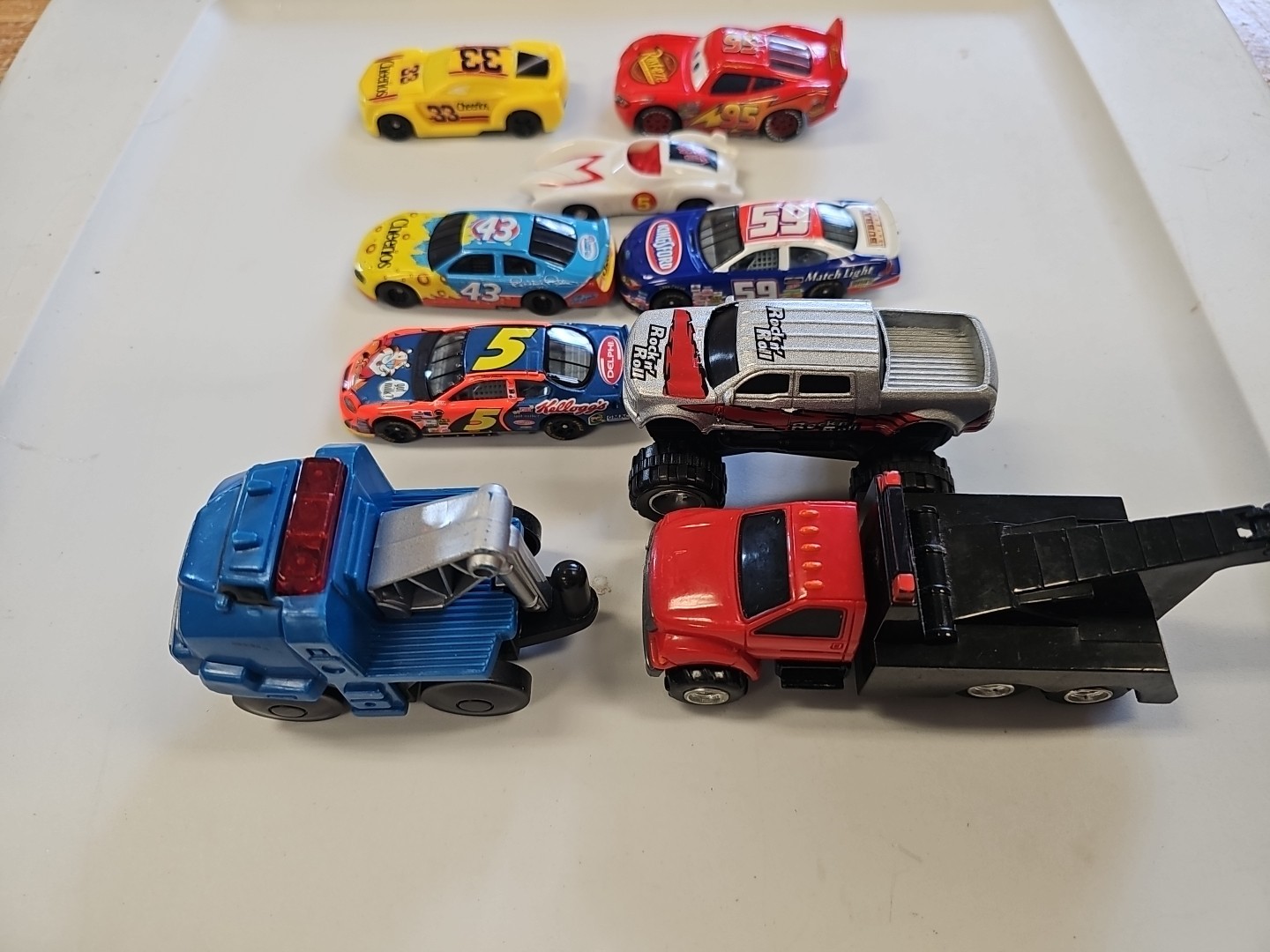 Lot Of 9 Assorted Die-Cast And Plastic Toy Cars Assorted manufacturing.