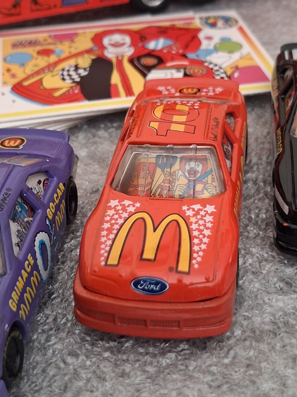 Lot of 1994 McDonaldland Transporter & 7 Car Racing Team set 1-64