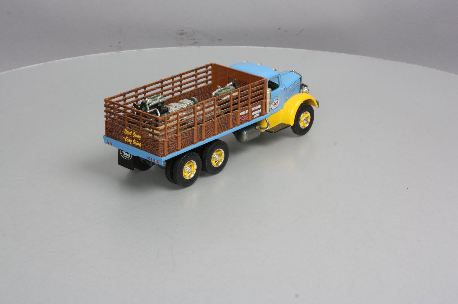 First Gear 19-3155 1:34 Scale Diecast Mack L Series Stake Truck with Engine Load