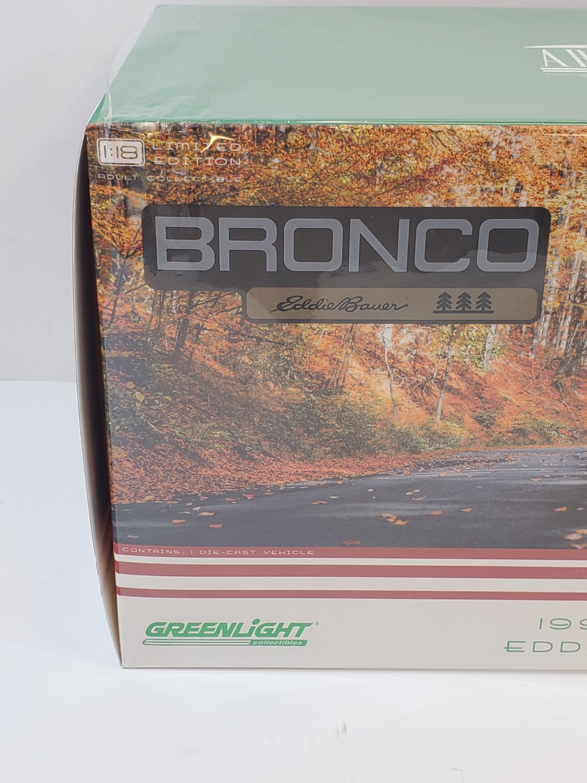 Greenlight 1994 Ford Bronco Eddie Bauer Edition Electric Red & Bronze 1/18
