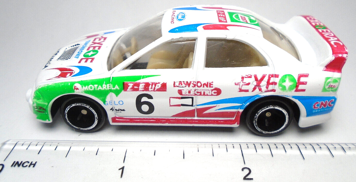 EXEOE WONROW MOTARELA #6 WHITE 1:64 DIECAST 3″ RACE CAR W GREEN RED & BLUE CHINA