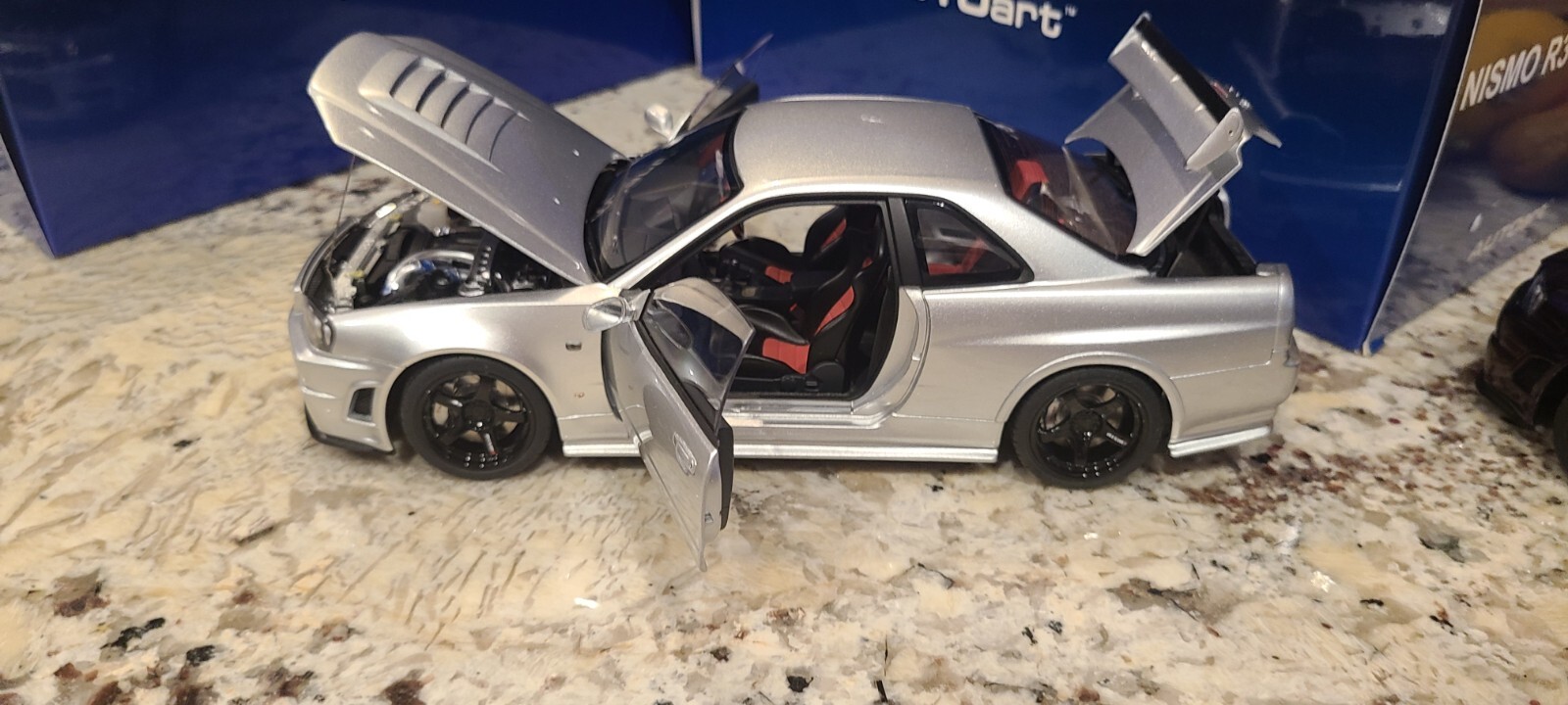 Nissan Skyline GT-R (R34) Z-Tune, Z-Tune Silver in 1:18 scale by AUTOart 77461